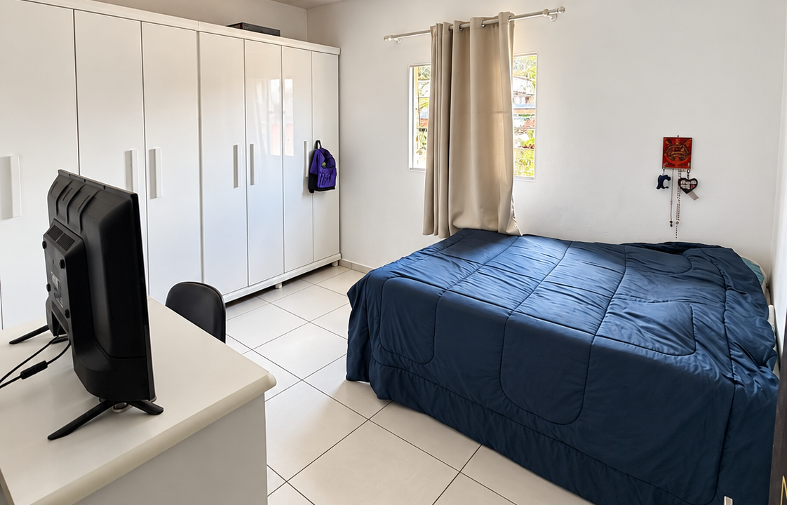 Quarto Minimalista com Cama Azul e Armário Branco